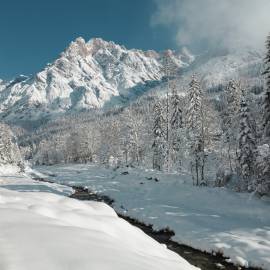 Winter landscape in Salzburger Land with snow-covered mountains and trees