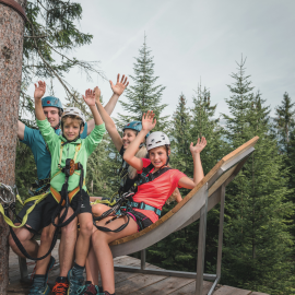 Family in the forest ropes course 