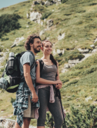 Young couple hiking in the mountains