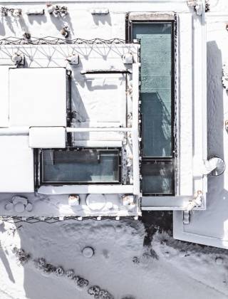 Aerial view of the TIARA SPA rooftop pool in winter at Hotel die HOCHKÖNIGIN in Maria Alm am Hochkönig, Salzburger Land, Austria.