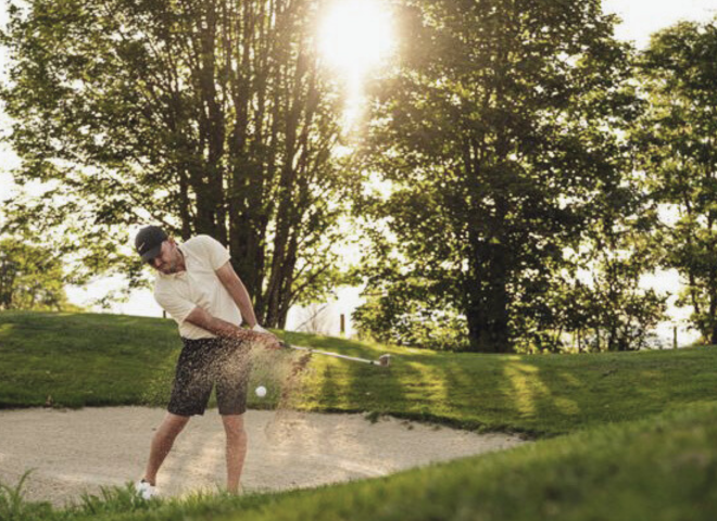 Golfers teeing off on the golf course 