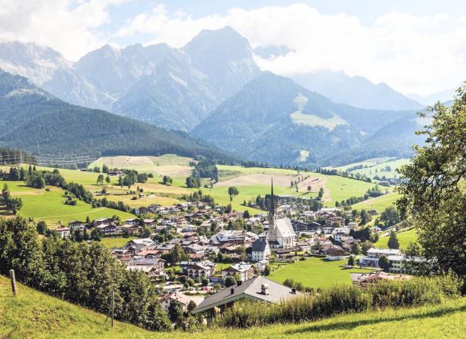 Panorama view of Maria Alm village with the Hochkönig mountains in the Austrian Alps