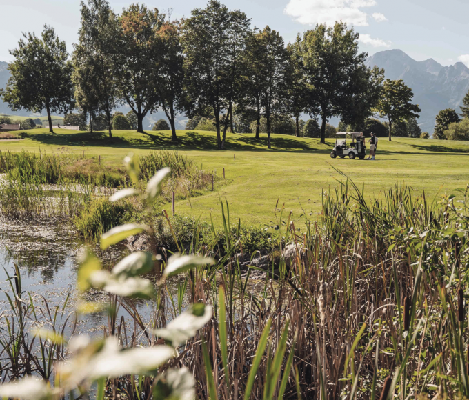 Golf course with pond and green