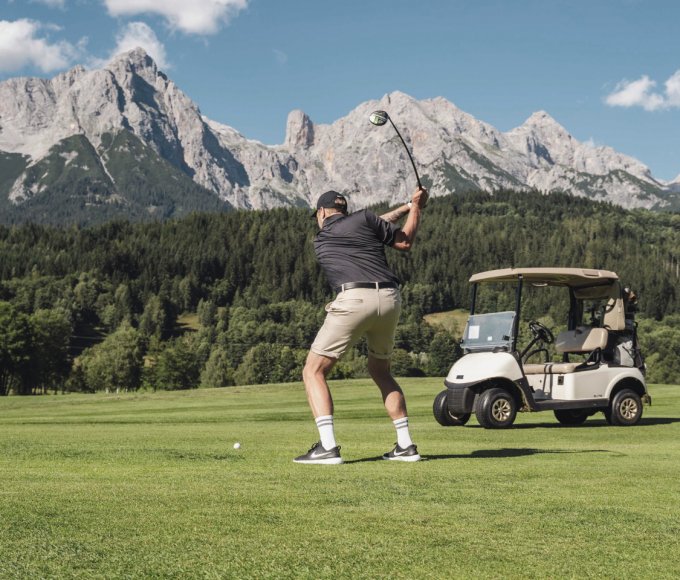 Golfers teeing off on the golf course