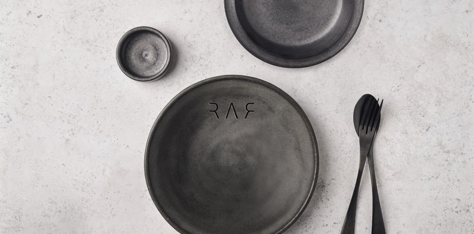 Black dinnerware with the RAR logo