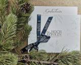 Voucher from Hotel die HOCHKÖNIGIN on a golden table with fir branches