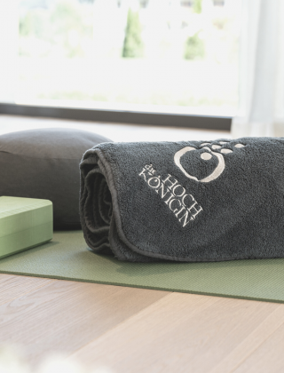 Fitness room with yoga mats in light colours