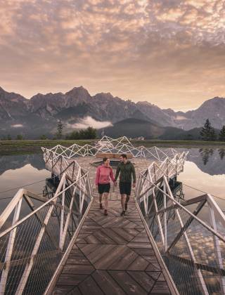 Couple hiking at Prinzensee at Natrun in the mountains in the Hochkönig region