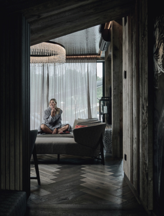 Woman sitting on a lounger in the elegant SPA area