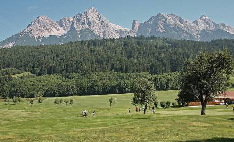 Golf course with a view of the mountains