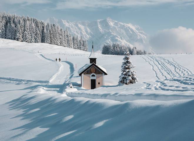 Winter landscape in Salzburger Land with snow-covered mountains and trees